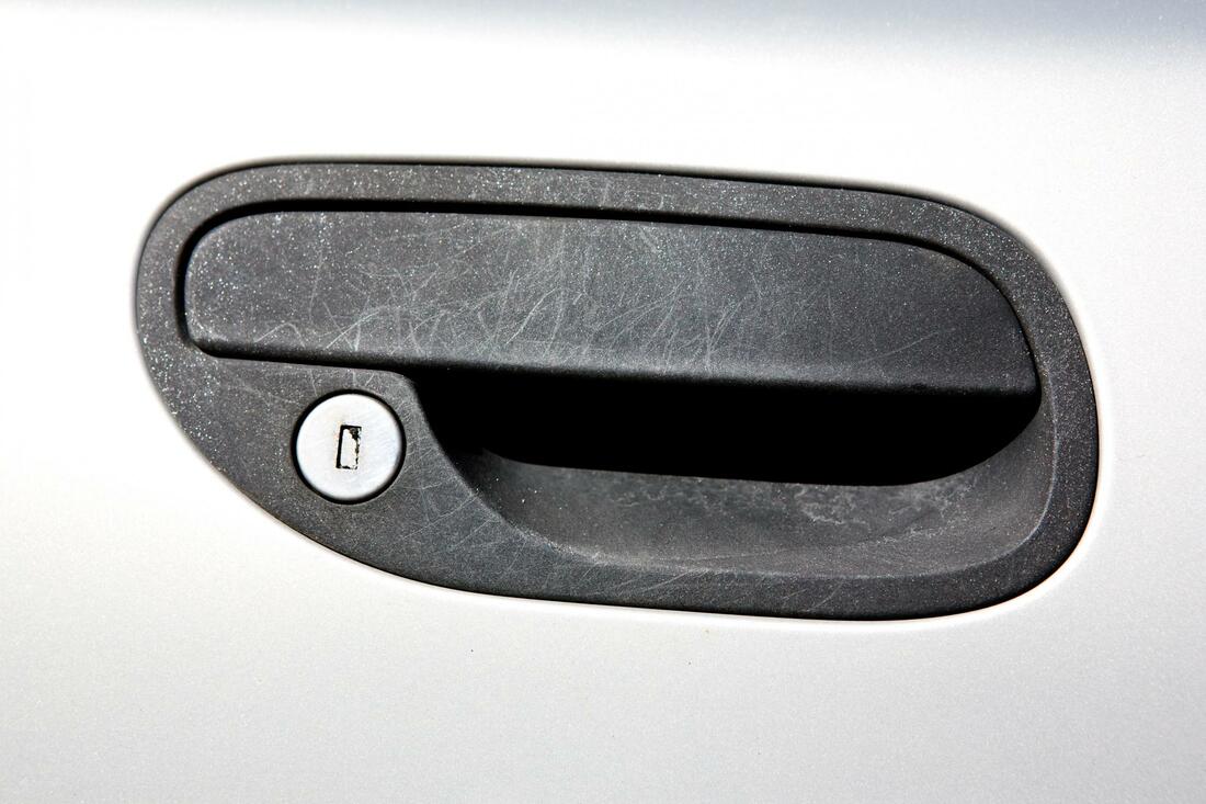 A locked car door handle