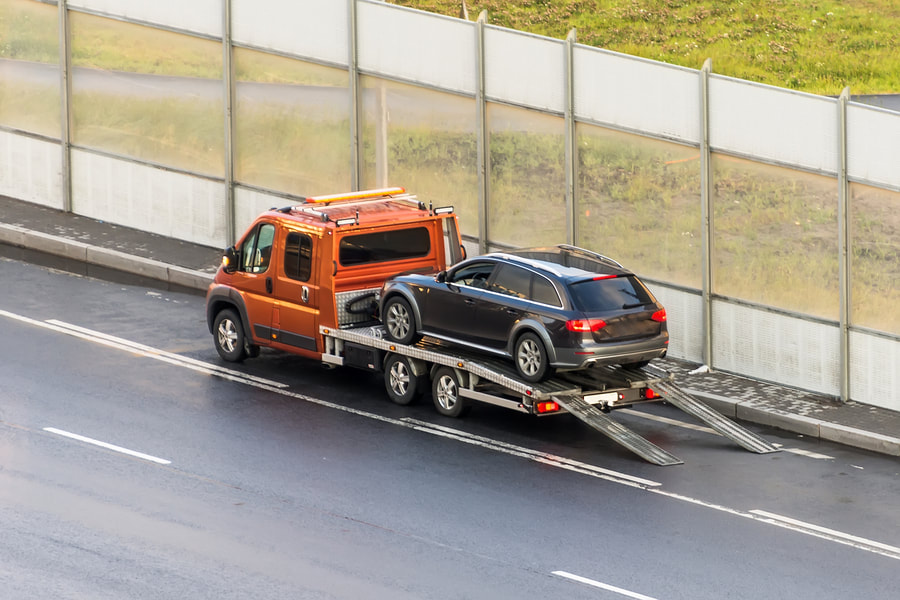 A tow truck towing a car